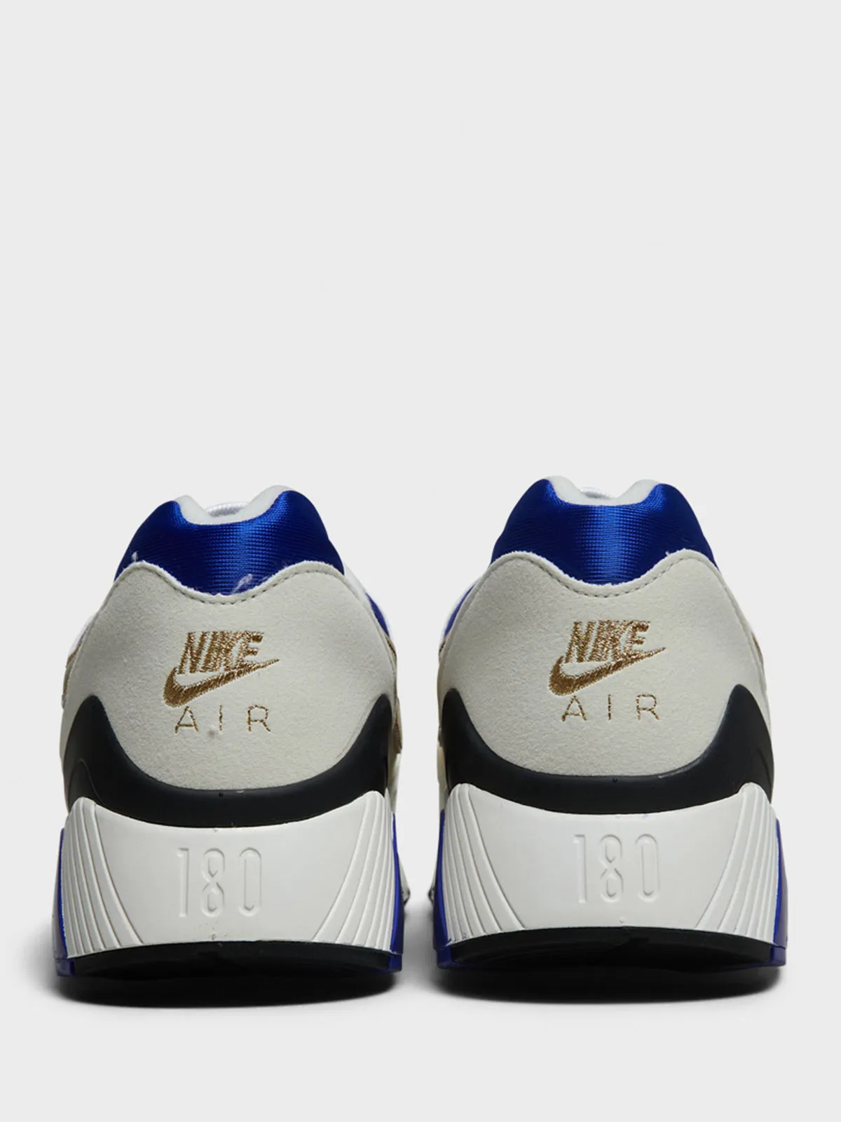 Air 180 Sneakers in Summit White and Metallic Gold